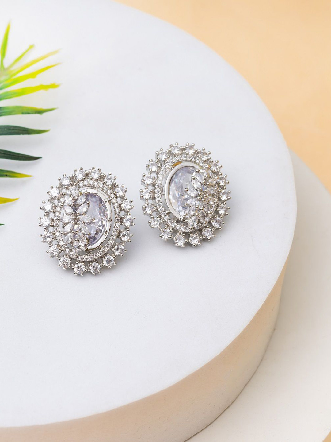 

PUTSTYLE Silver-Plated Oval Shaped American Diamond Studded Studs Earrings