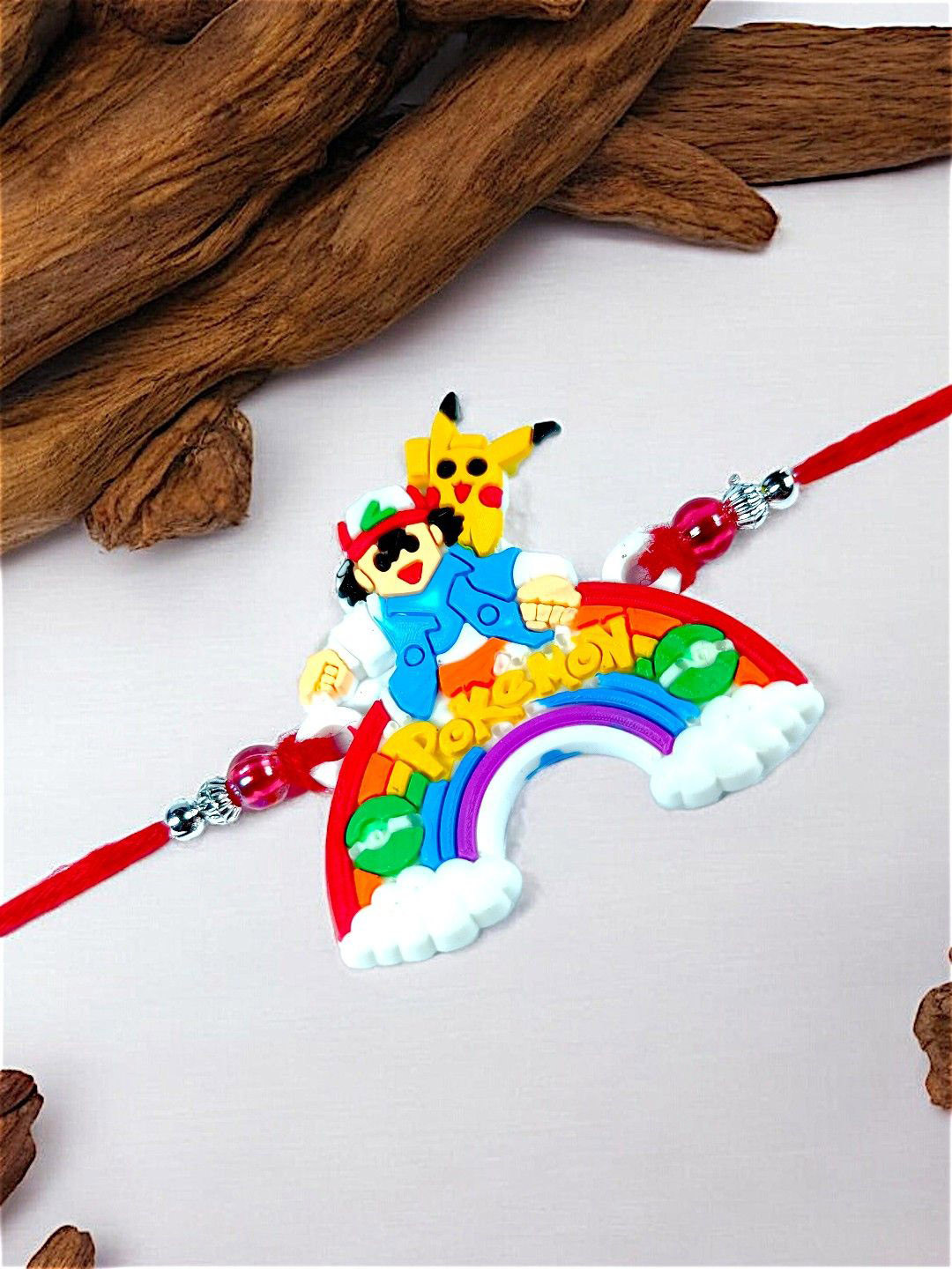 

ADIVA Boys POKEMON Thread Rakhi with Roli Chawal, White