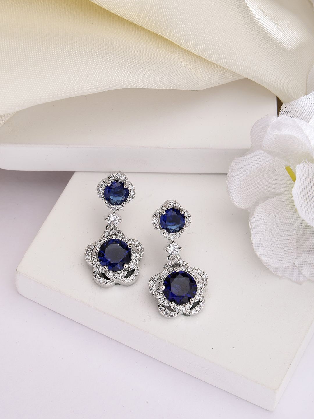

ZENEME Silver Plated Circular American Diamond Studded Drop Earrings, Blue