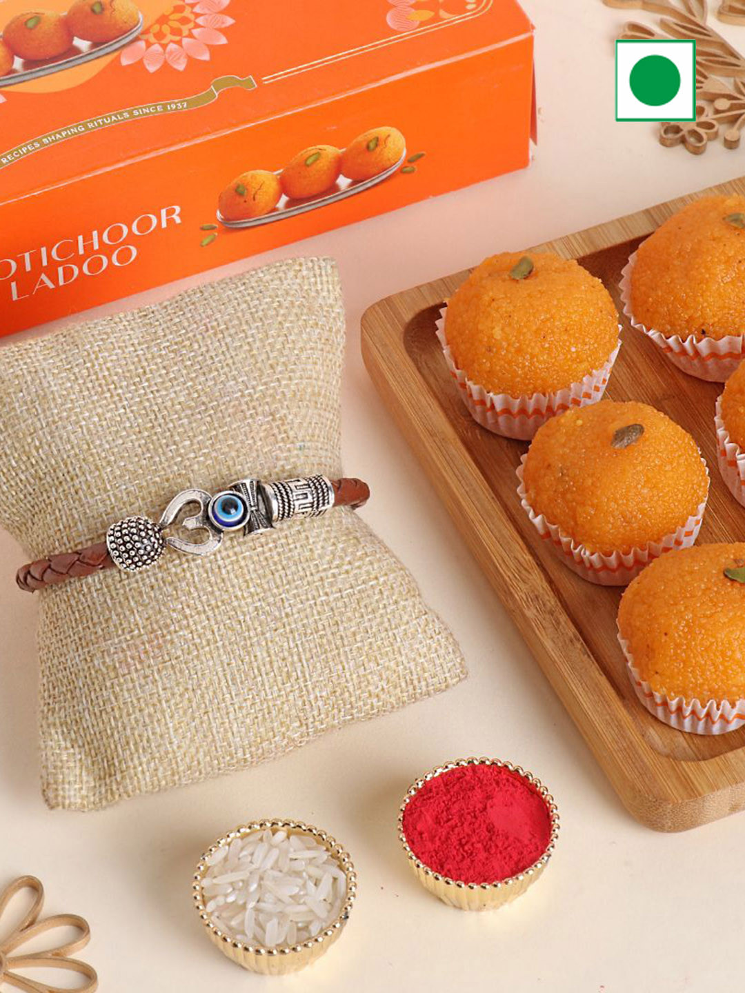

Floweraura Rakhi With Motichoor Ladoo 250 g, Orange