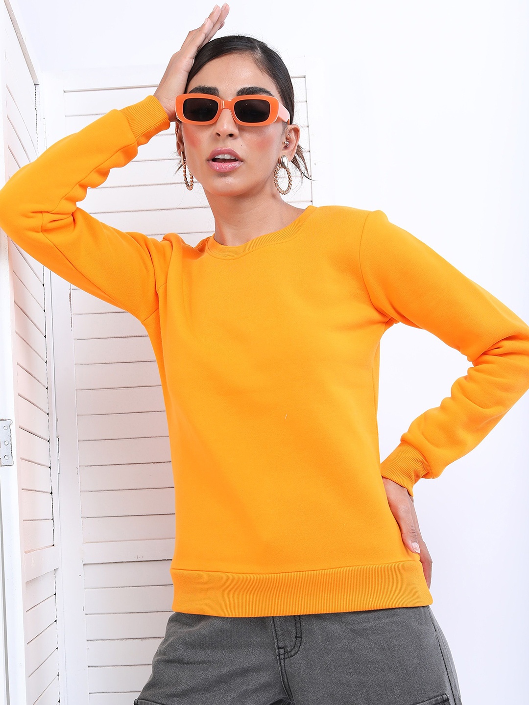 

Tokyo Talkies Women Solid Sweatshirt, Orange