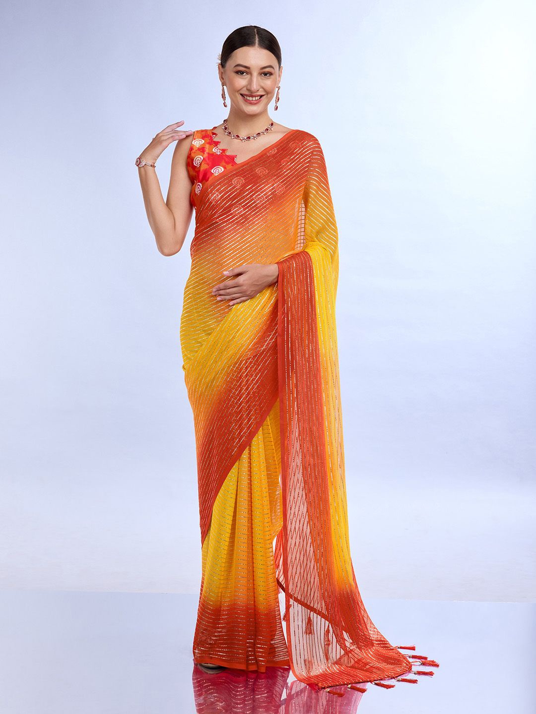 

Ishin Striped Embellished Poly Chiffon Saree, Yellow