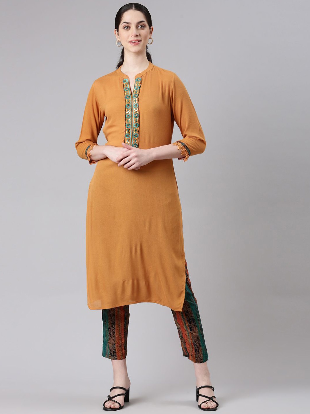 

Neerus Yoke Design Thread Work Straight Kurta with Trousers, Mustard