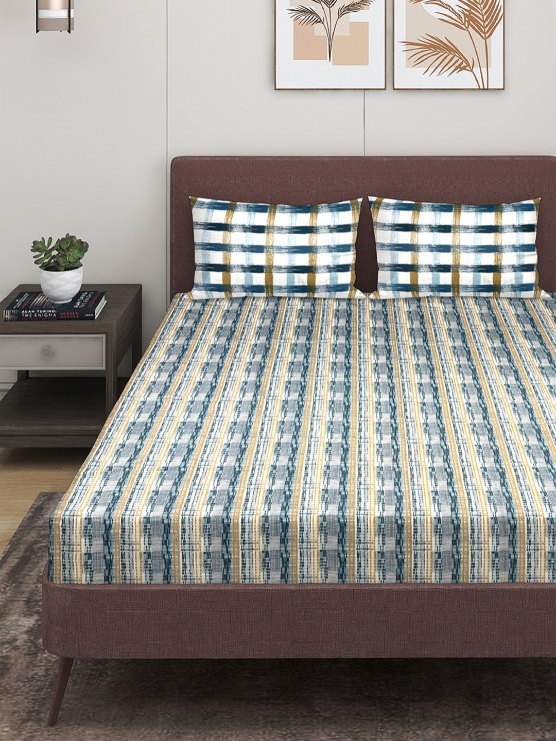

Myntra Elegant Homes Blue & White Geometric 210TC Cotton King Bedsheet & 2 Pillow Covers