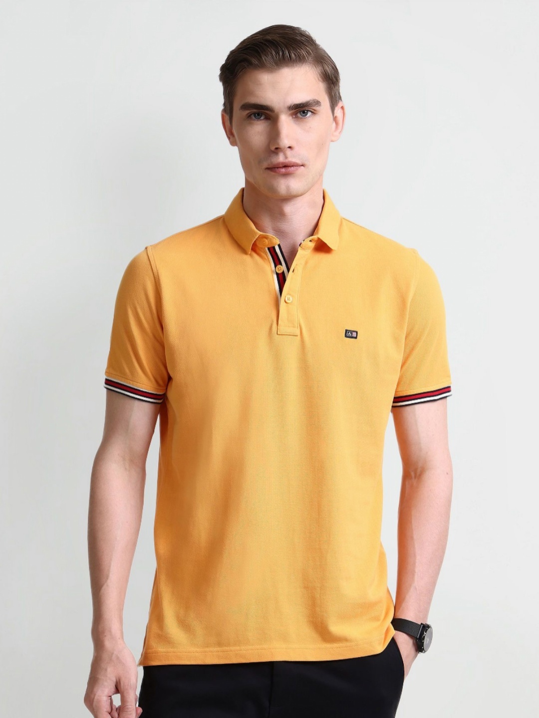 

Arrow Sport Men Solid Polo Collar Cotton T-shirt, Yellow