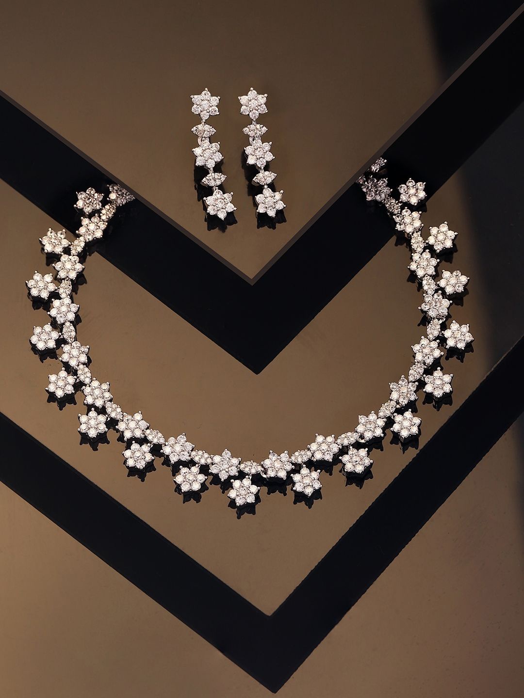 

Priyaasi Silver-Plated American Diamond Studded Foral Design Jewellery Set