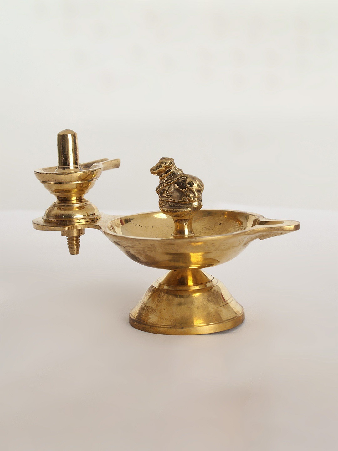 

Exotic India Brass Nandi Diya With Shiva Linga, Yellow