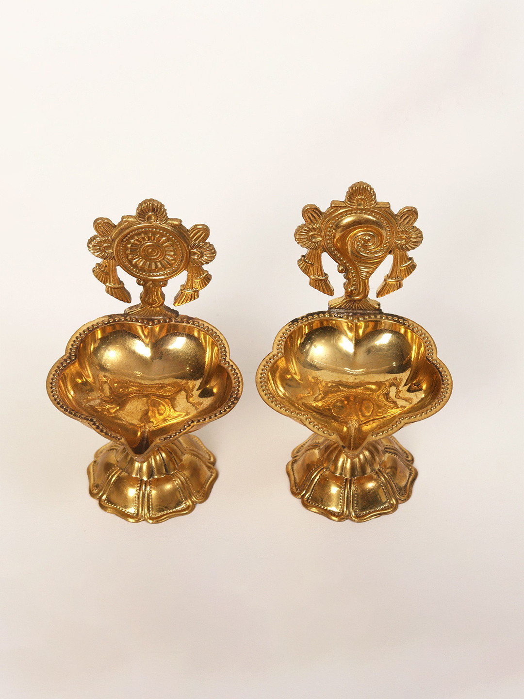 

Exotic India 2 Piece of Shankh Chakra Oil Lamps, Gold