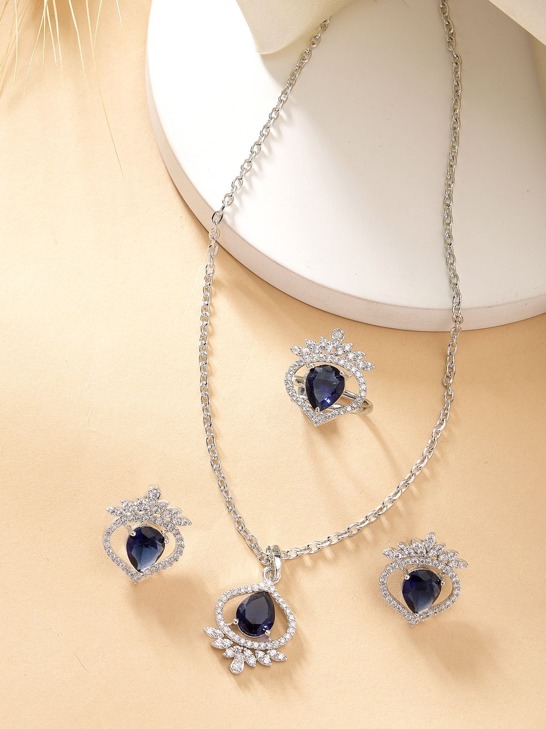 

ZENEME Silver Plated AD Studded Trilliant Crystal Necklace and Earrings With Ring