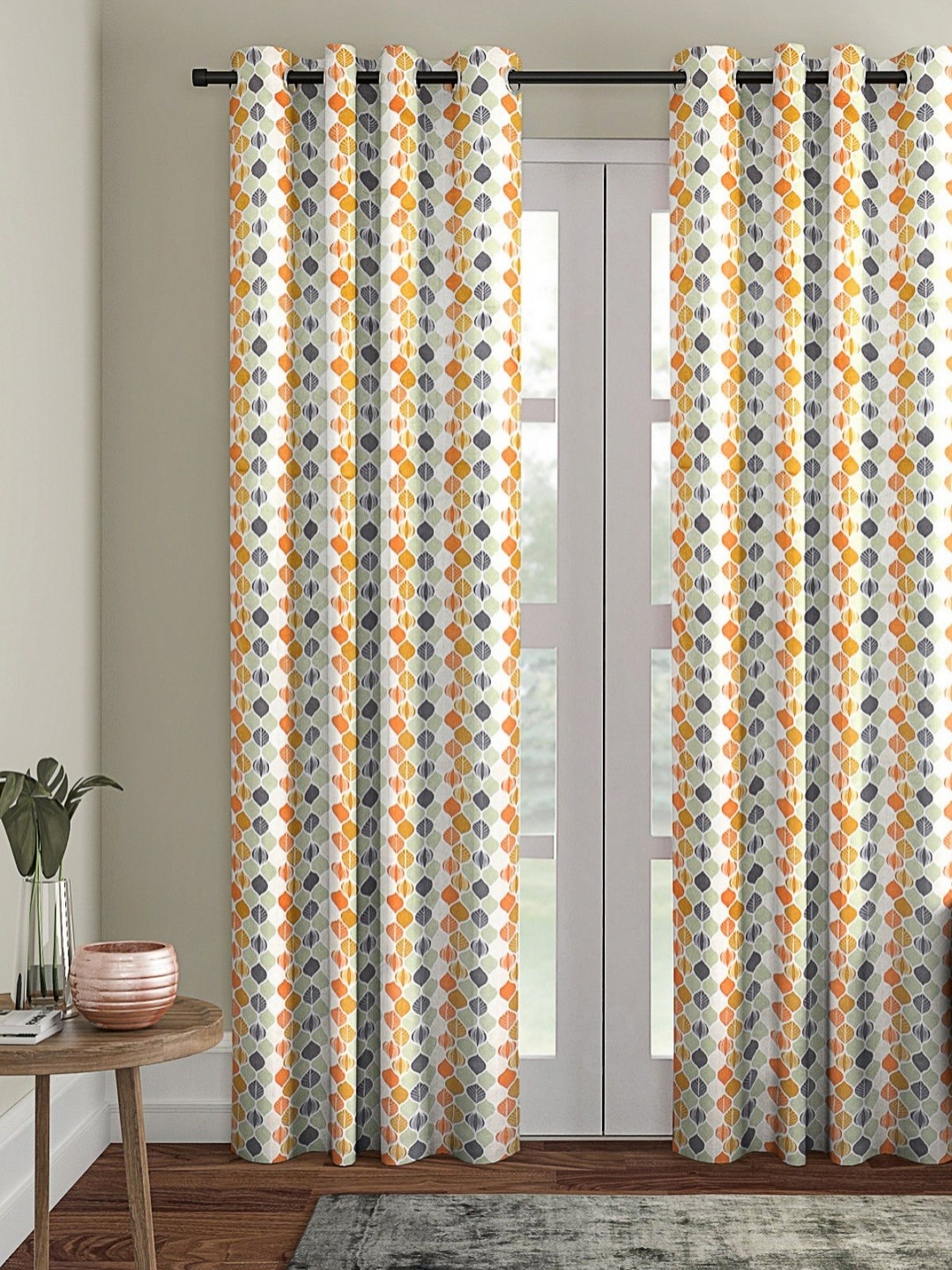 

Myntra Elegant Homes White & Orange Geometric Room Darkening Door Curtain