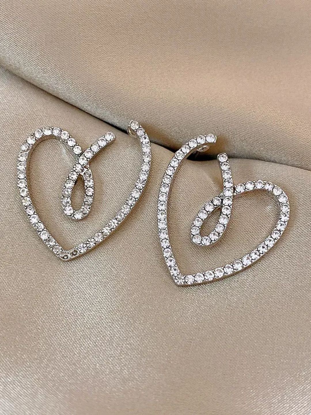 

Krelin Rhodium Plated Twisted Hollow Out Heart Shaped Drop Earrings, Silver
