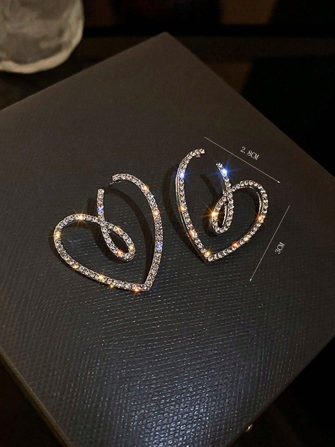 

Krelin Rhodium Plated Twisted Hollow Out Heart Shaped Studs, Silver
