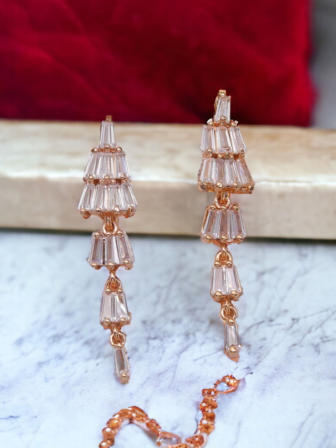 

The Pari Gold-Plated American Diamond Studded Contemporary Drop Earrings