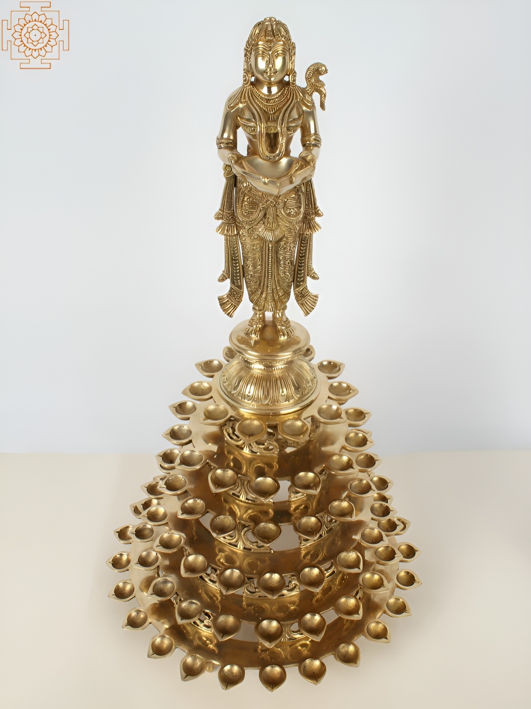 

Exotic India Gold-Toned Brass Deep Lakshmi 108 Wicks Lamp