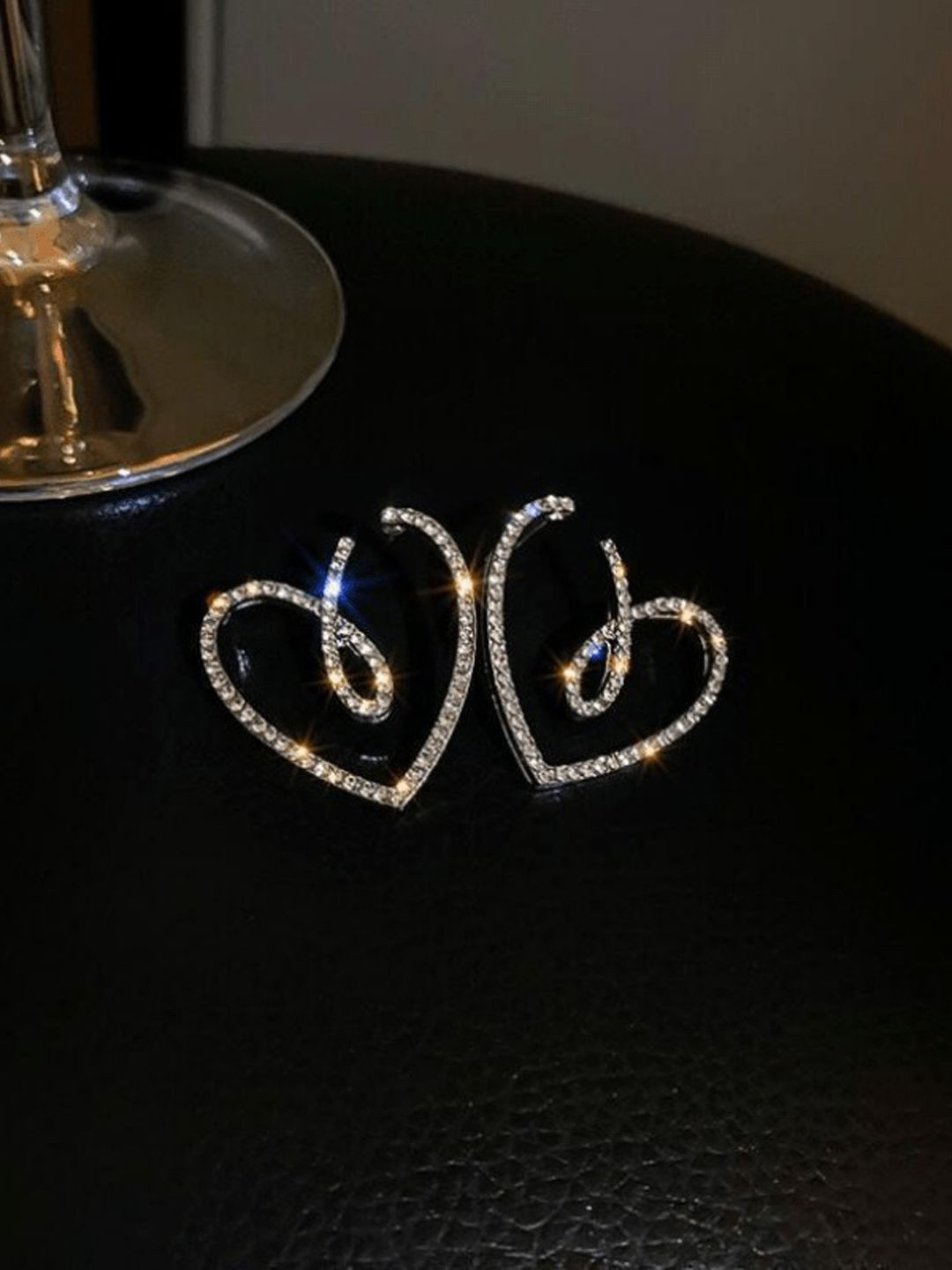 

Krelin Rhodium Plated Twisted Hollow Out Heart Shaped Studs, Silver