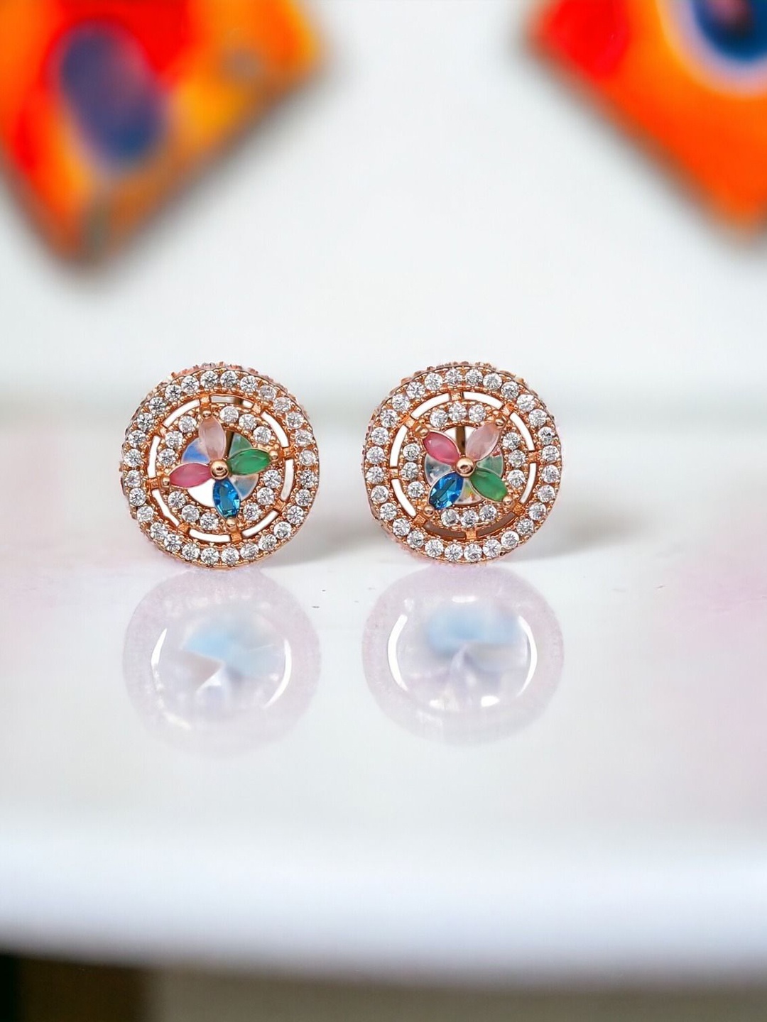 

The Pari Rose Gold-Plated American Diamond Studded Contemporary Studs Earrings