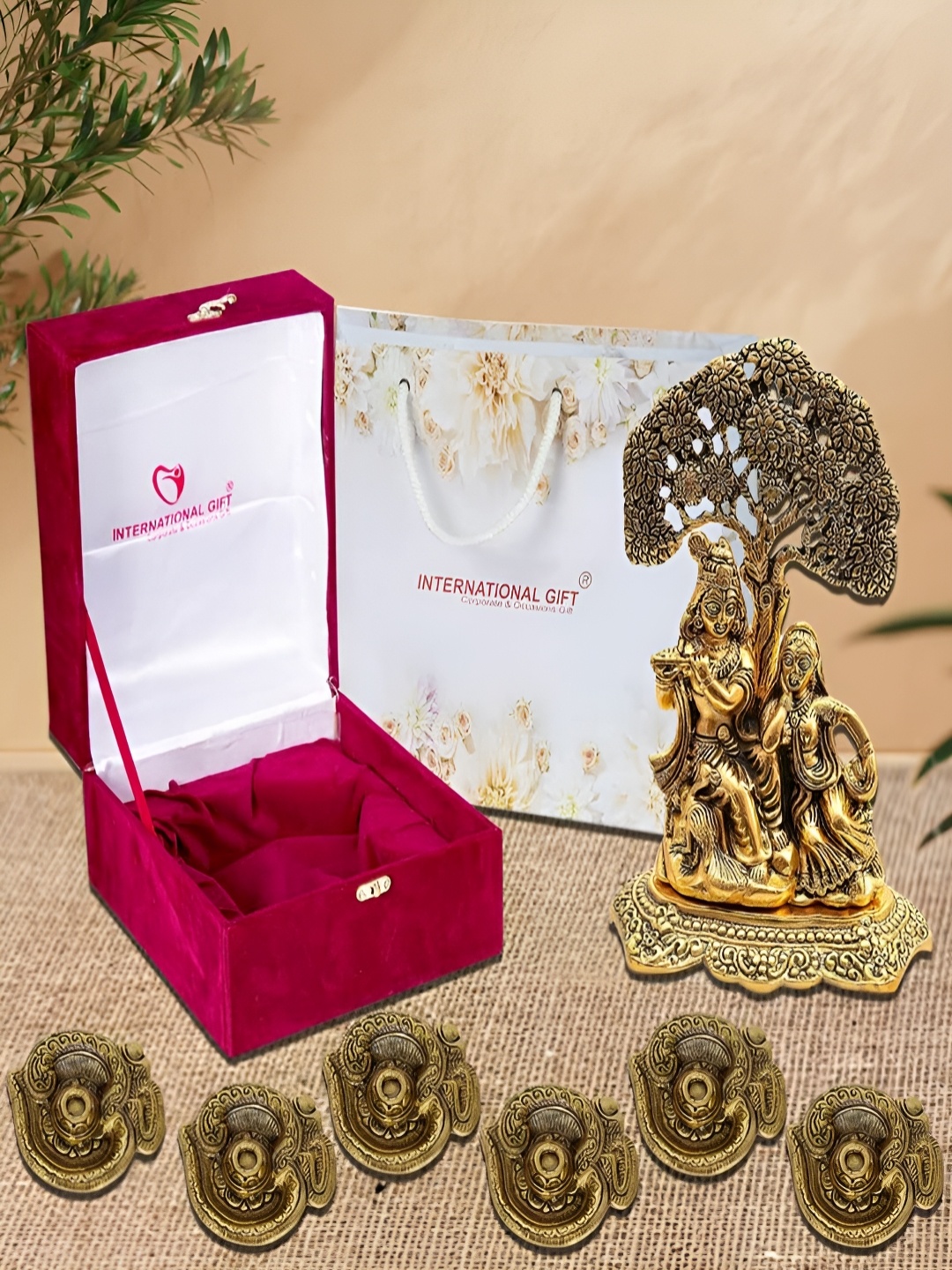 

INTERNATIONAL GIFT 7 Pieces Gold-Toned Radha Krishna Idol & Om Diyas With Box