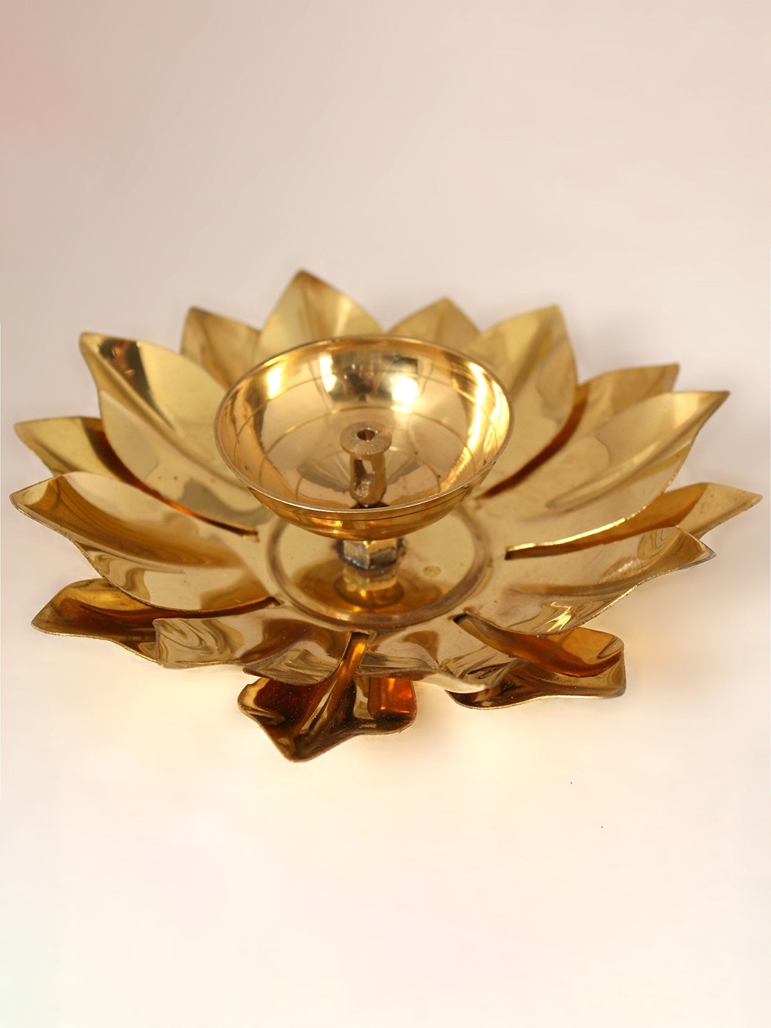 

Exotic India 1" Brass Small Oil Lamp With Lotus Leaves, Gold