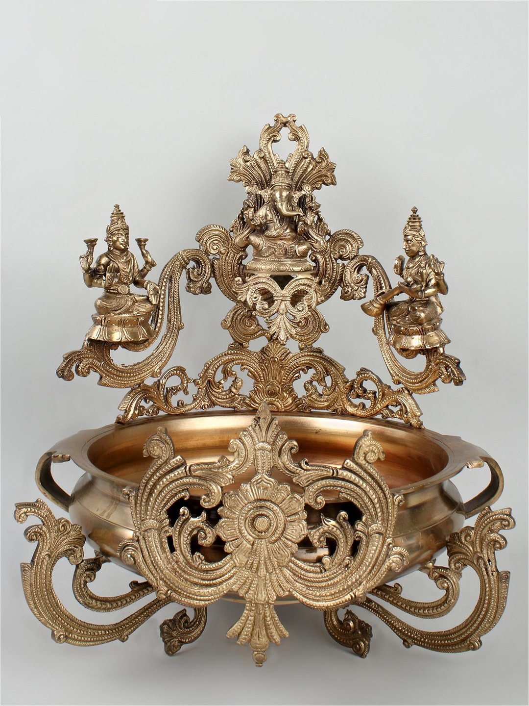 

Exotic India 19" Ganesha-Lakshmi-Saraswati Urli (Hoysala Art) in Bronze, Gold