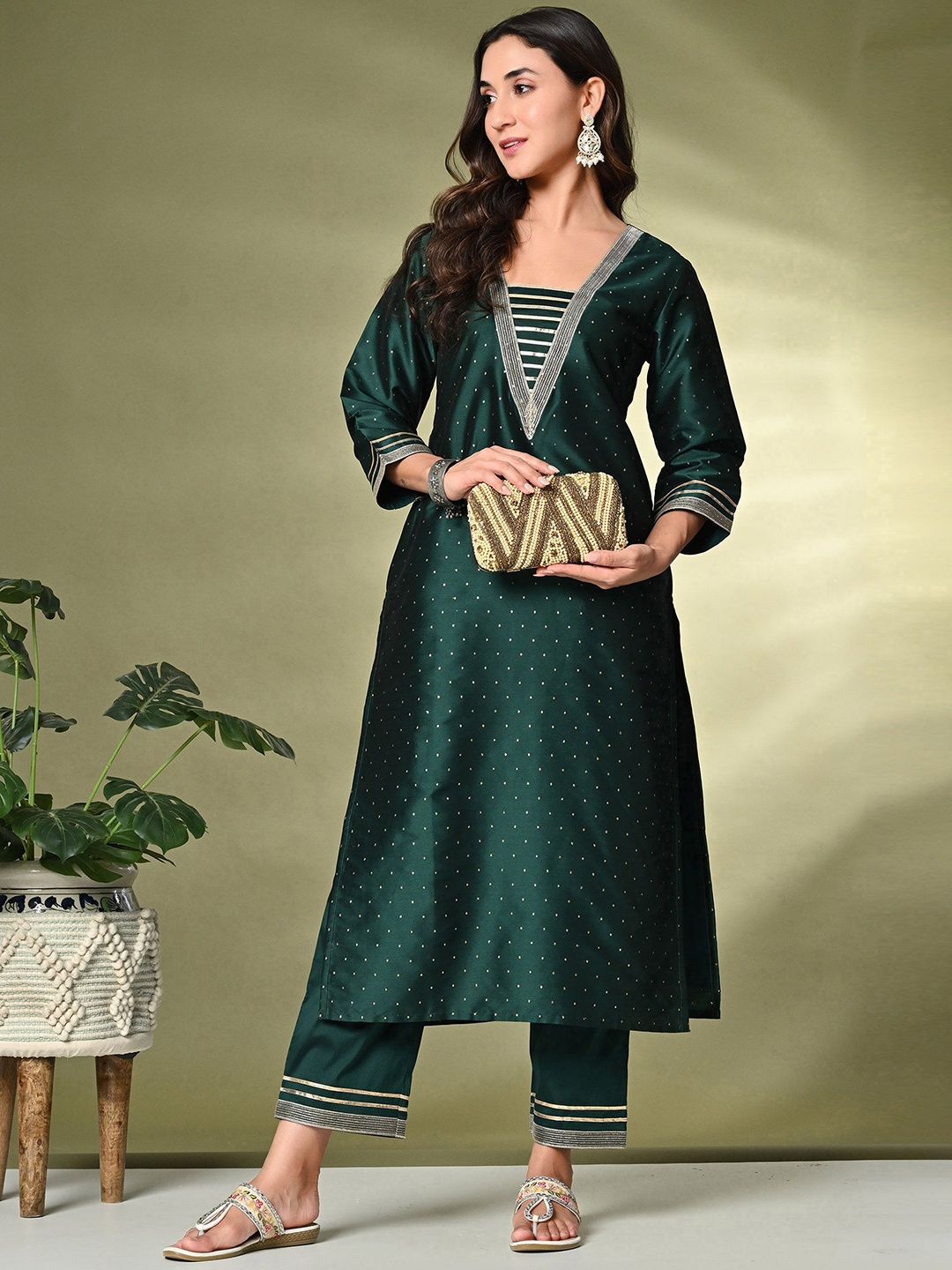 

Sangria Green Ethnic Motifs Embroidered A-Line Kurta With Trousers