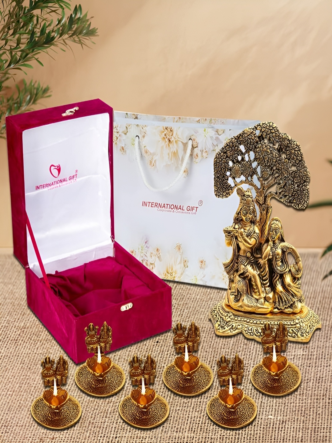 

INTERNATIONAL GIFT 7 Pieces Gold-Toned Ram Krishna Idol & Om Diyas With Box