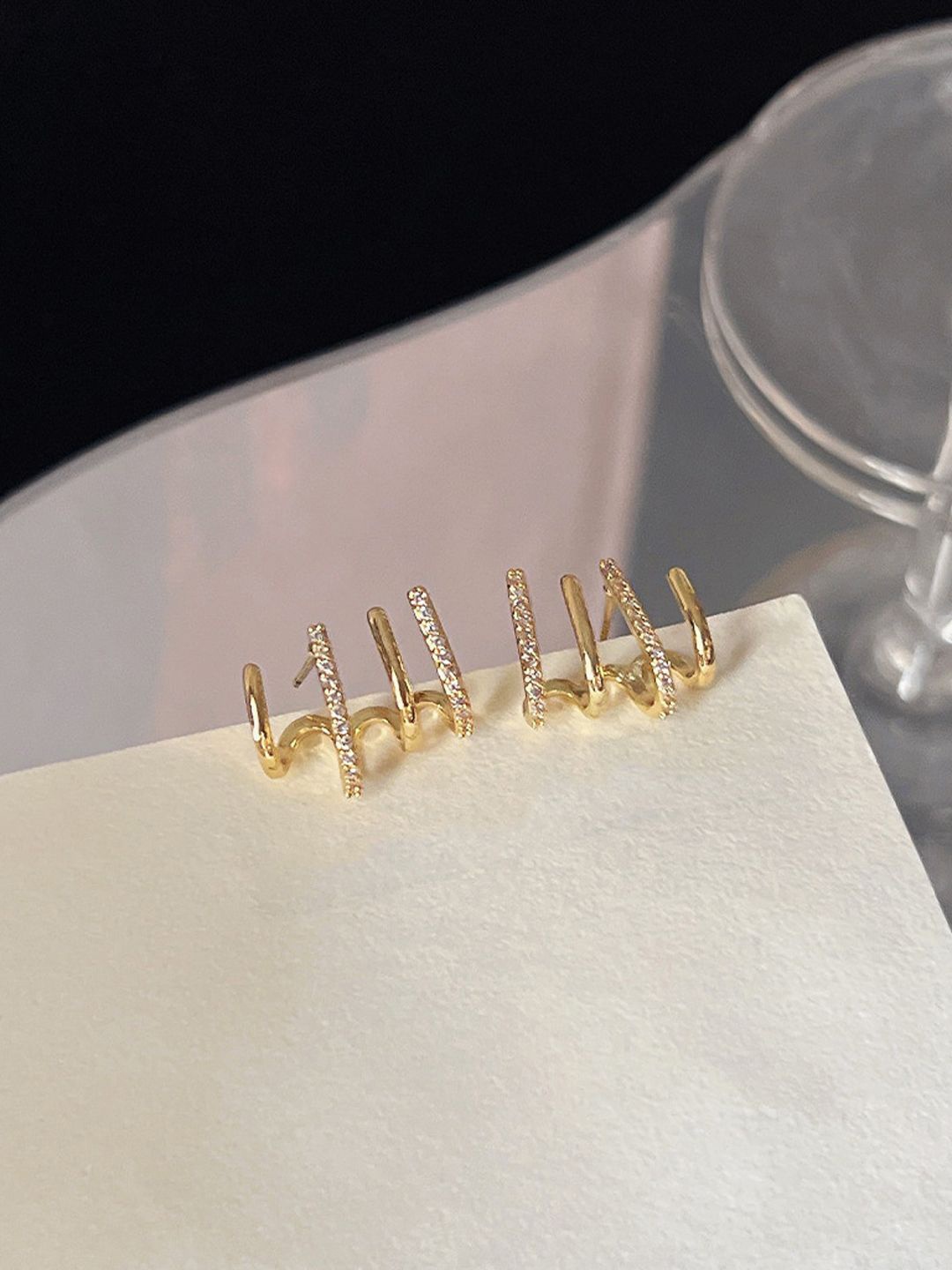

VAGHBHATT Gold-Plated Cubic Zirconia Studded Classic Claw-Shaped Studs