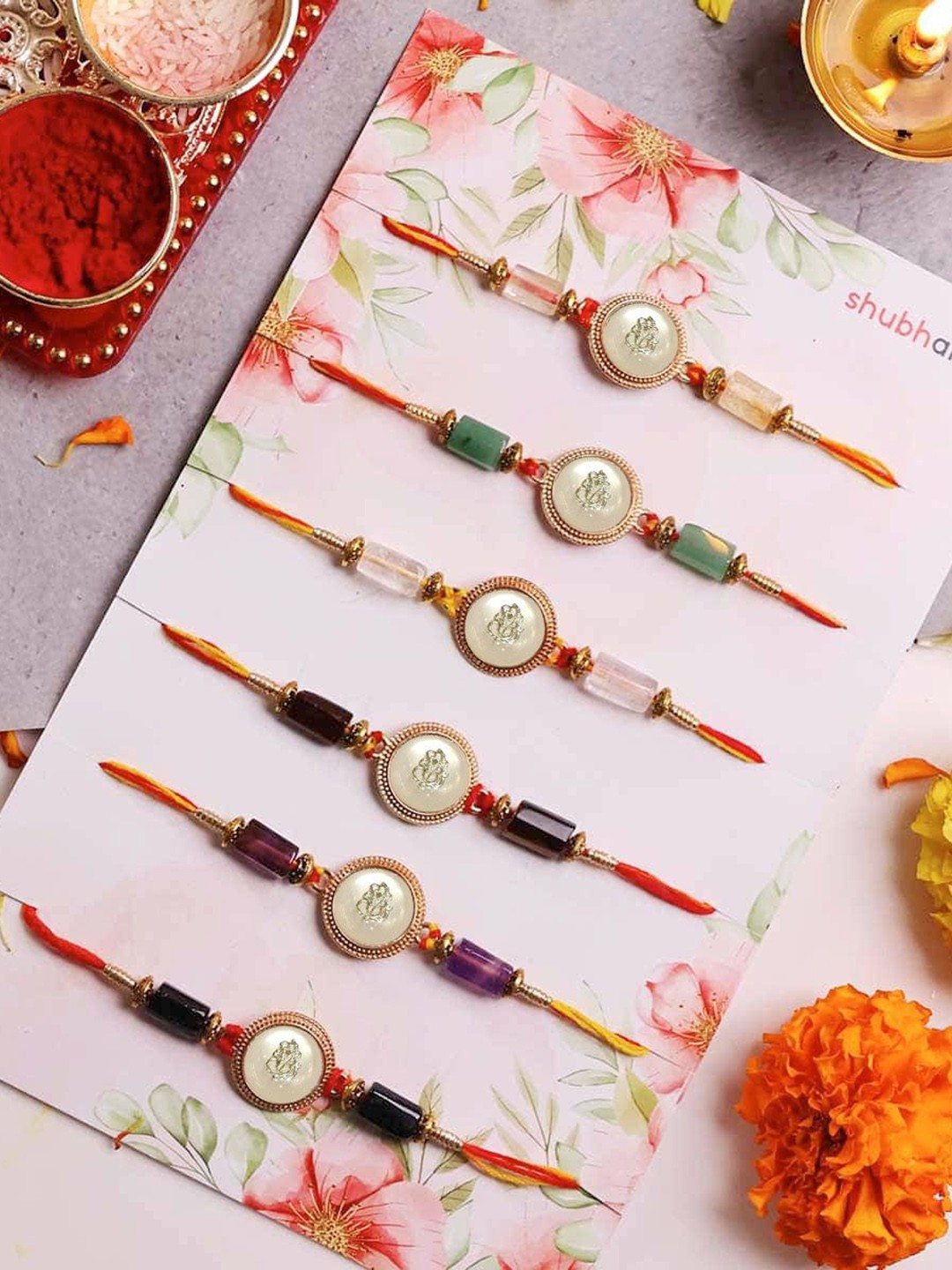 

Shubhanjali Set of 6 Ganesha Charm Thread Rakhis With Roli Chawal & Greeting Card, Red