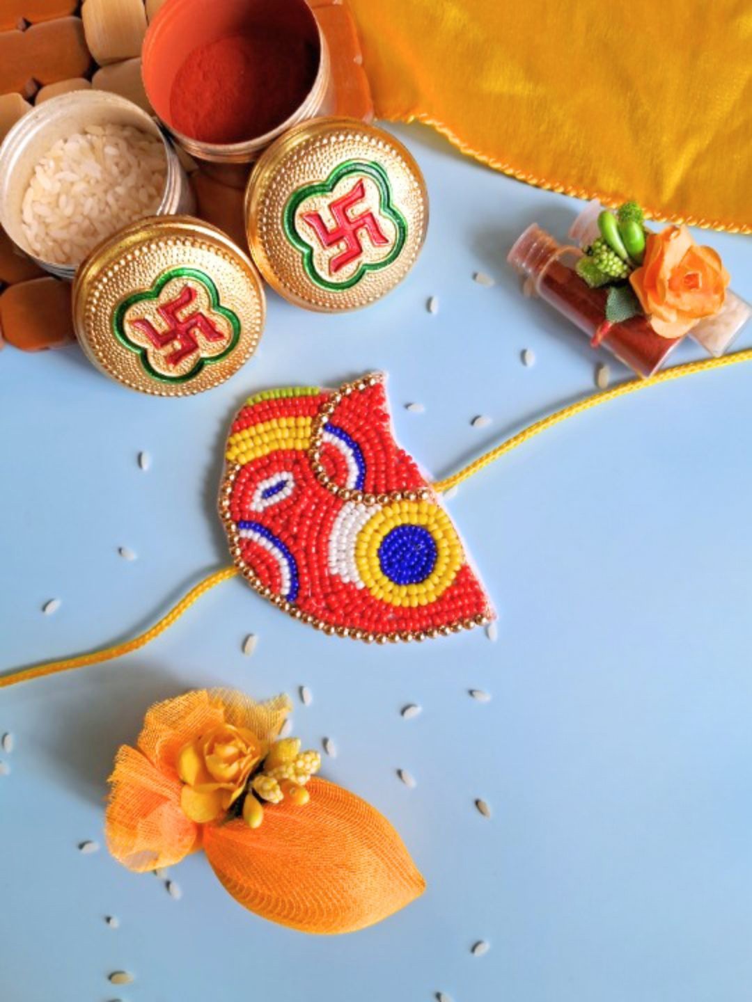 

Sangria Set Of 2 Veerji GaneshjiRakhi With Roli Chawal & Greeting Card, Red