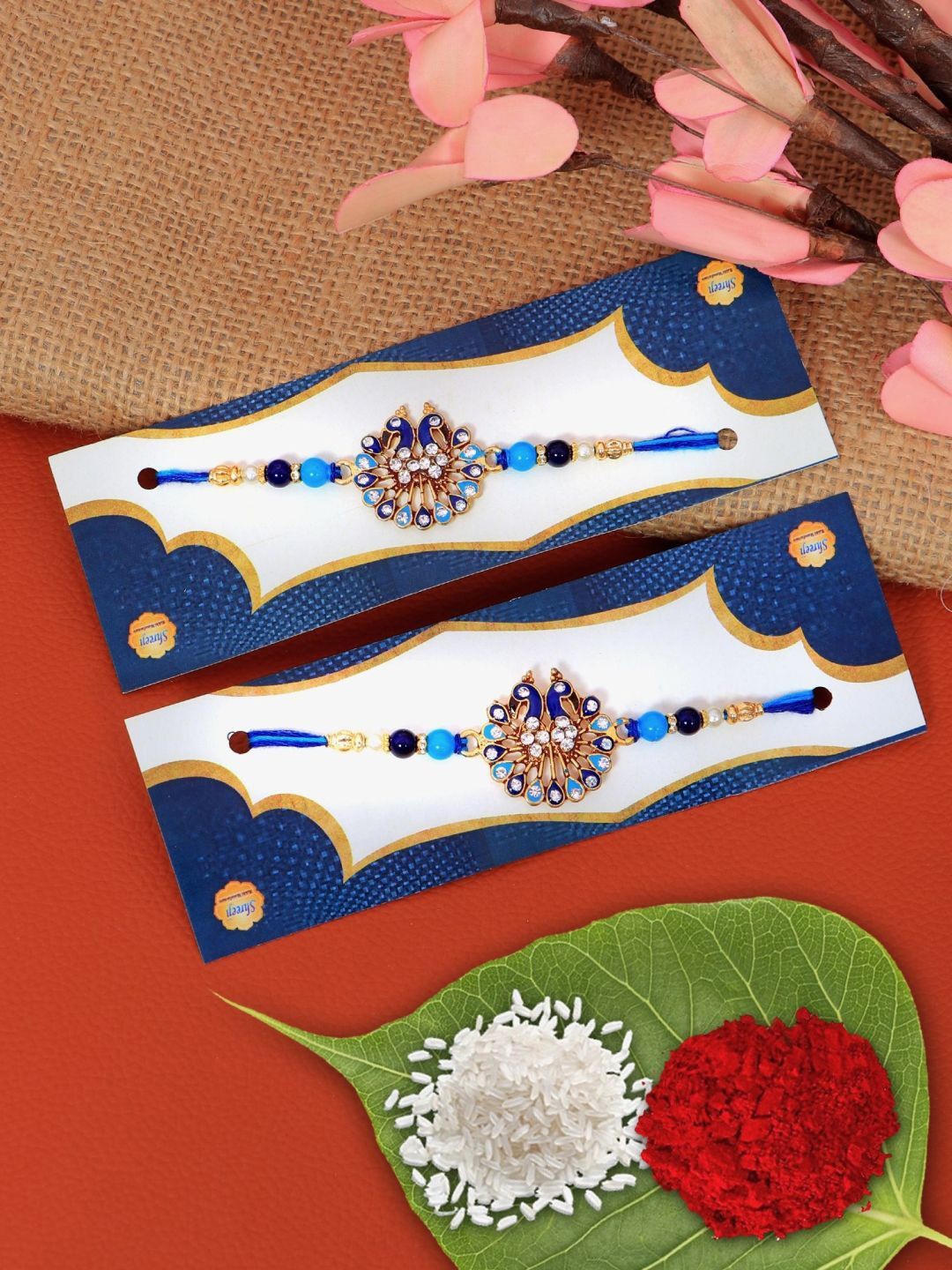 

Crunchy Fashion Set Of 2 Stone Studded Beaded Thread Rakhis With Roli Chawal, Gold