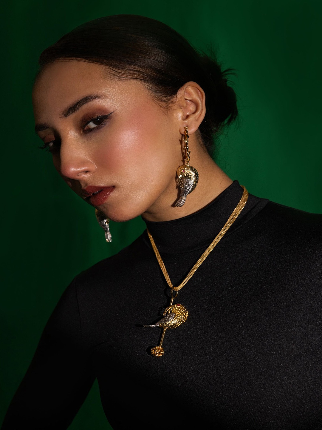 

Trupti Mohta Birdy Golden Fling Gold Plated Contemporary Drop Earrings