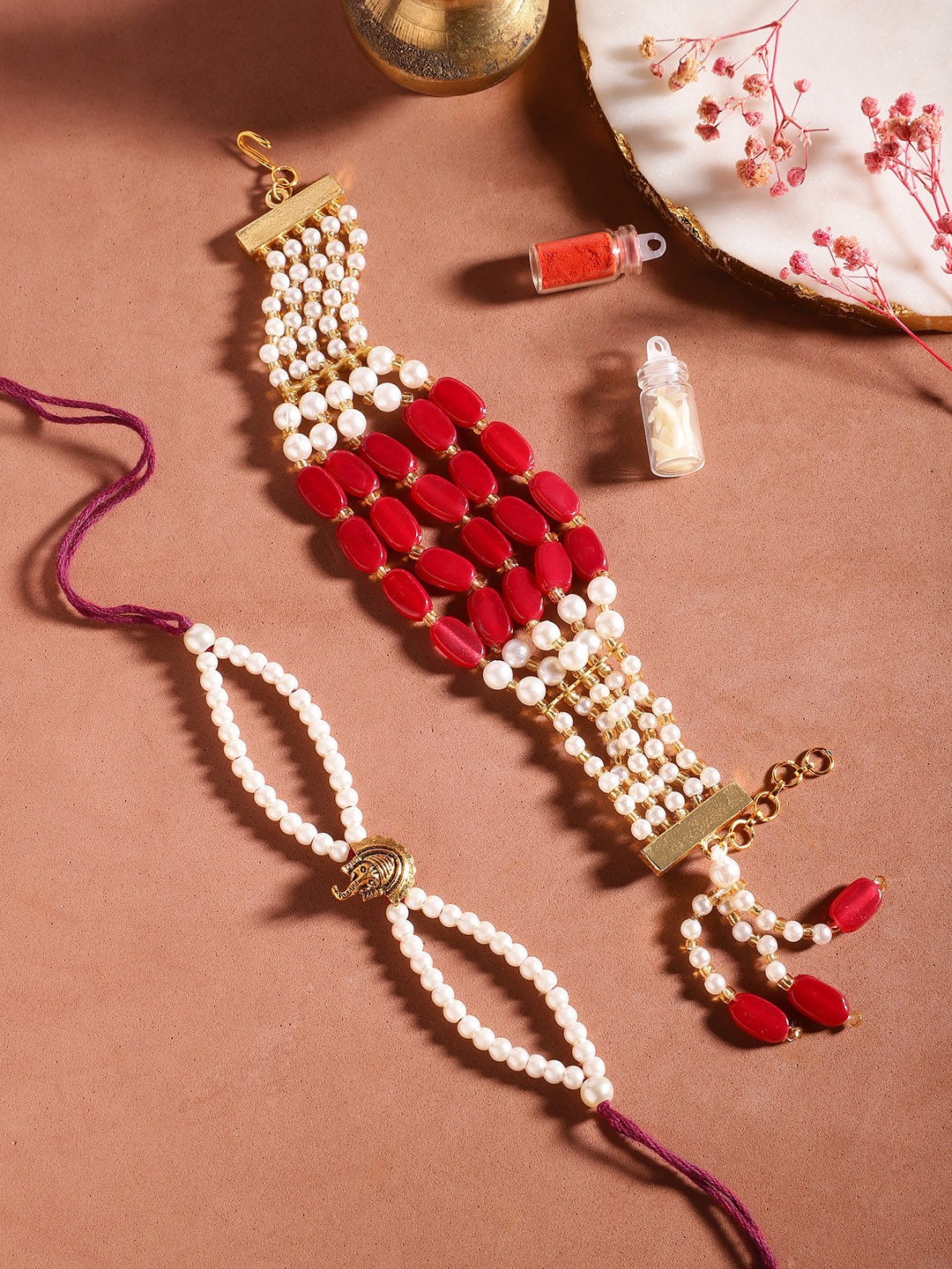 

Anouk Unisex Set of 2 Beaded Bhai Bhabhi Rakhis With Roli & Chawal, Maroon