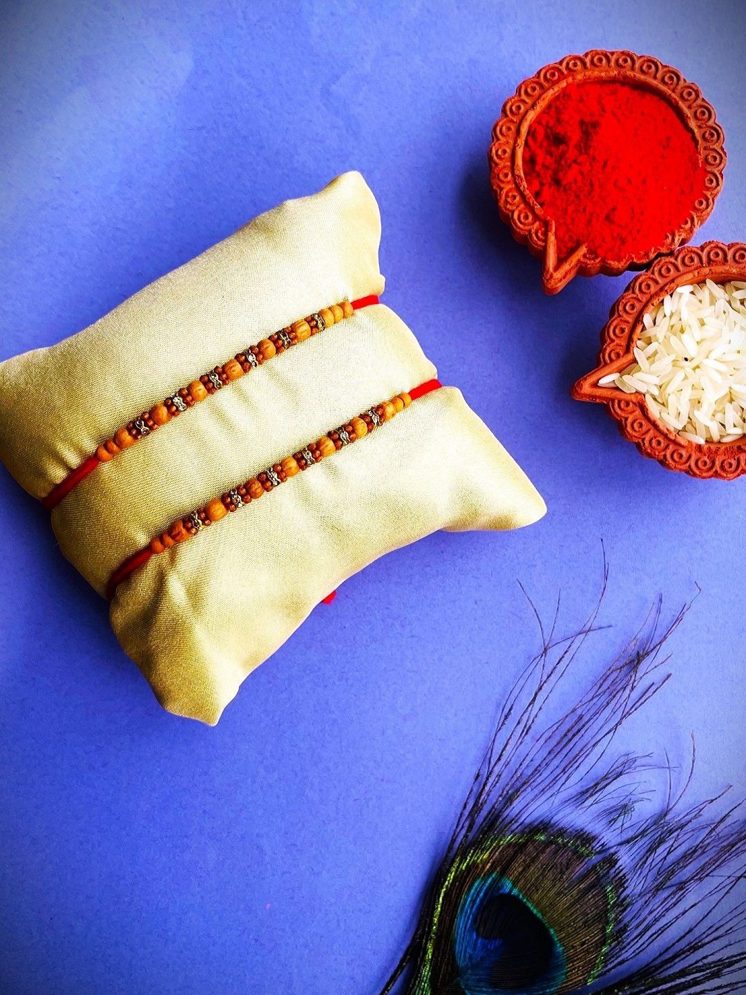 

Crunchy Fashion Set Of 2 Stone Studded & Beaded Thread Rakhis With Roli Chawal, Red