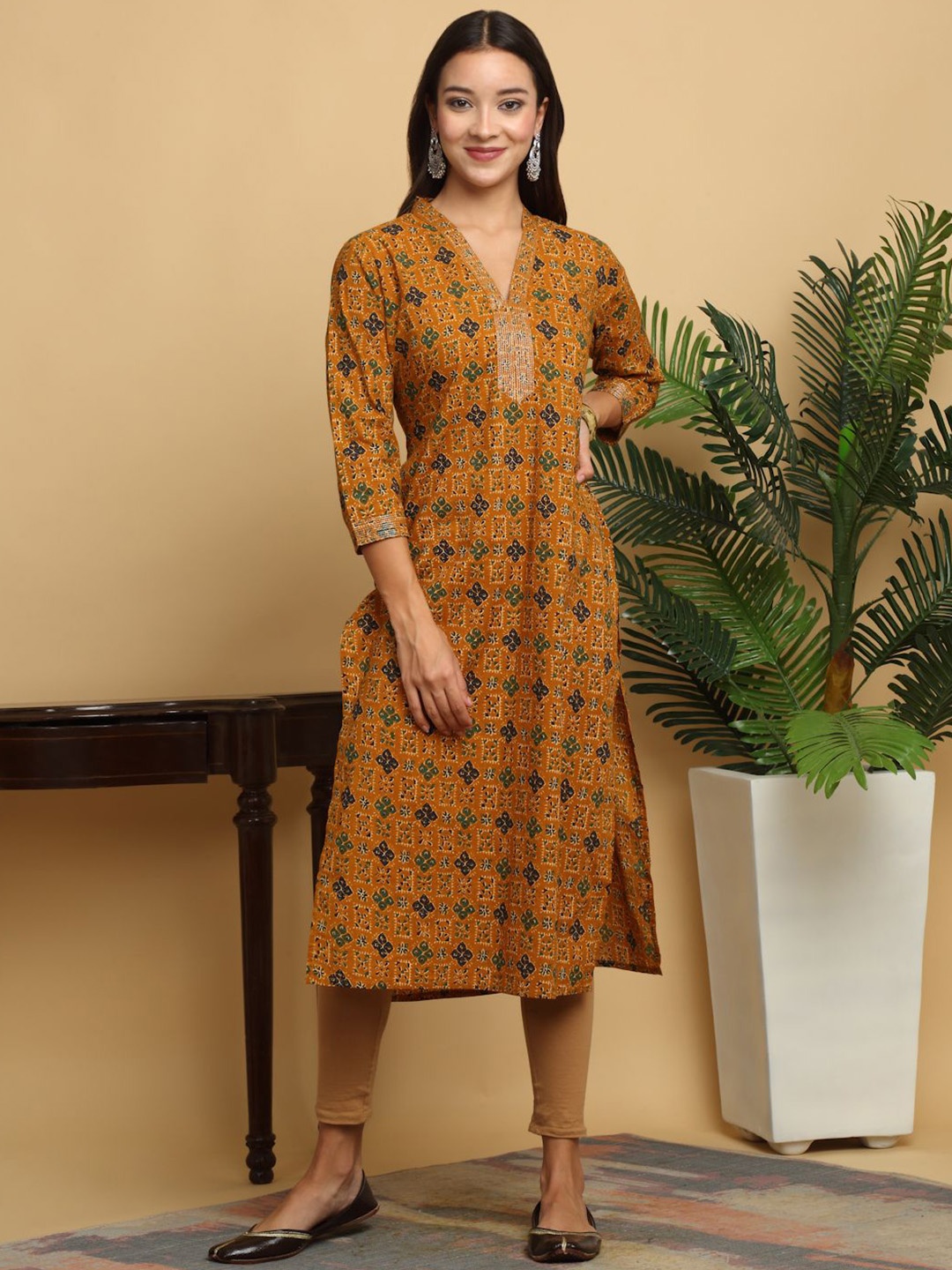 

KALINI Women Floral Printed Flared Sleeves Mirror Work Kurta, Mustard