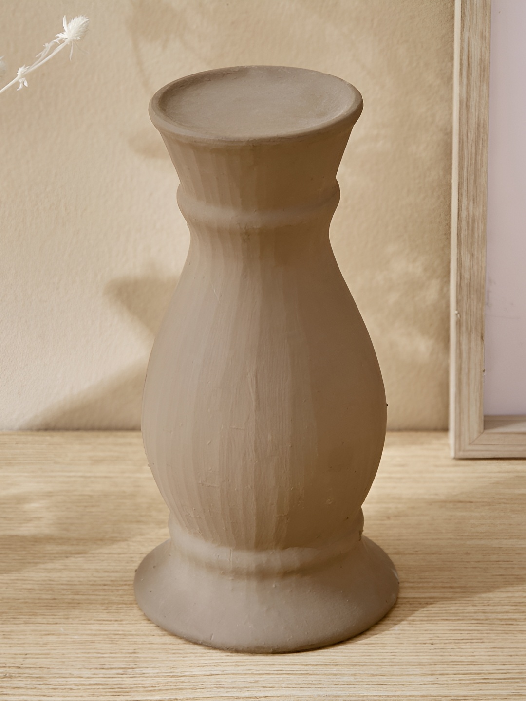 

Home Centre Brown Ceramic Candle Holder