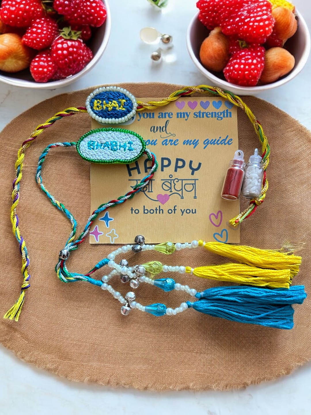 

JEWELWATI Set Of 2 Bhaiya-Bhabhi Rakhi With Card & Roli Chawal, Yellow