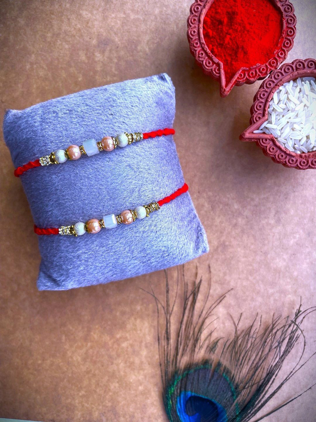 

Crunchy Fashion Set Of 2 Stone Studded Beaded Thread Rakhis With Roli Chawal, Gold