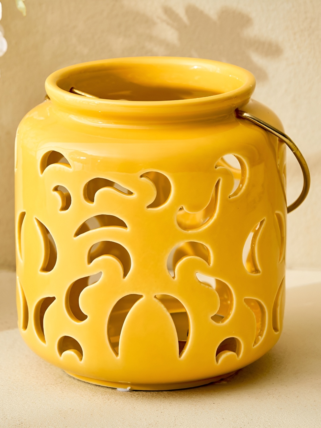 

Home Centre Yellow Ceramic Hanging Lantern Candle Holder