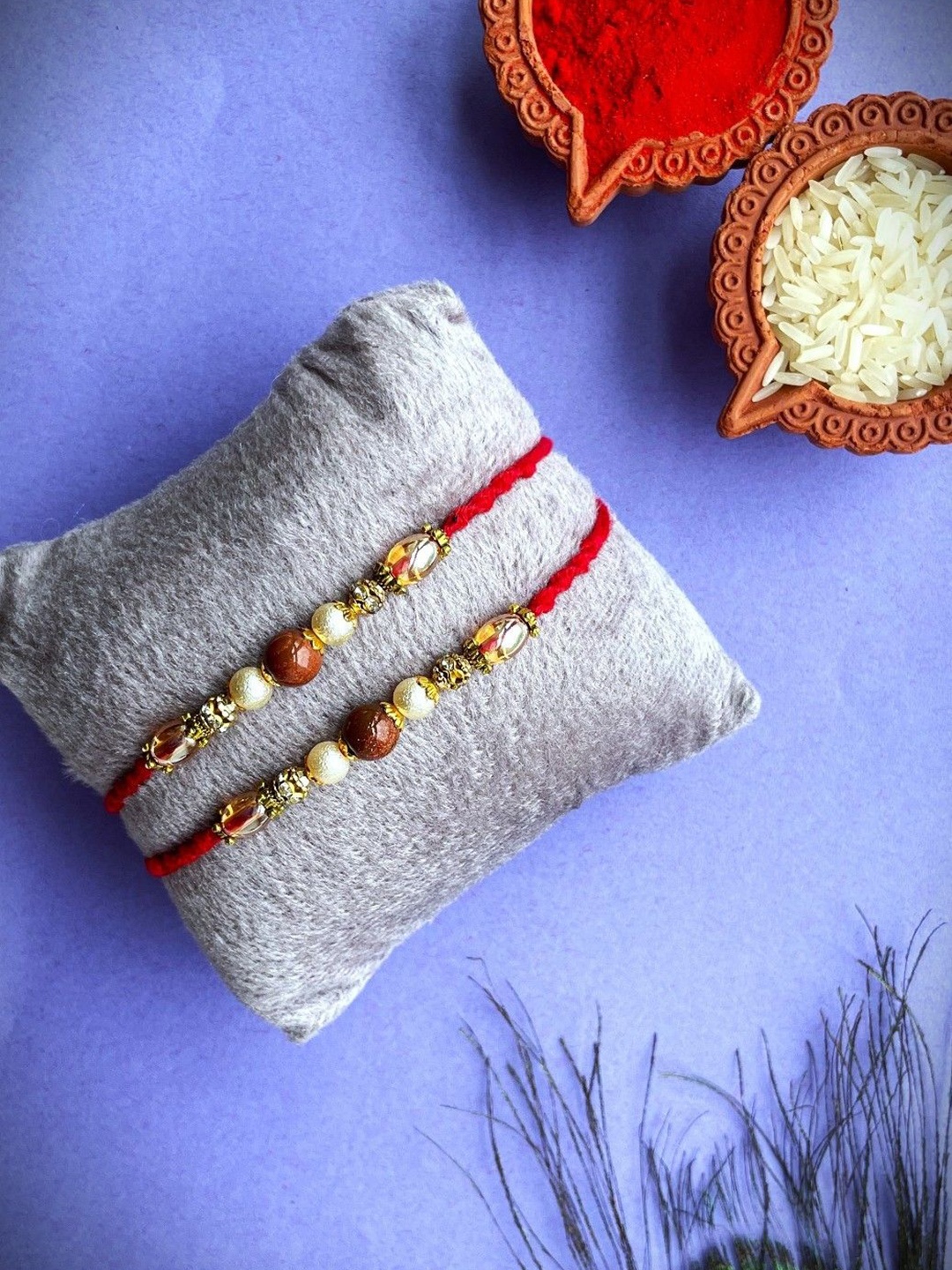 

Crunchy Fashion Set Of 2 Stone Studded Beaded Thread Rakhis With Roli Chawal, Gold
