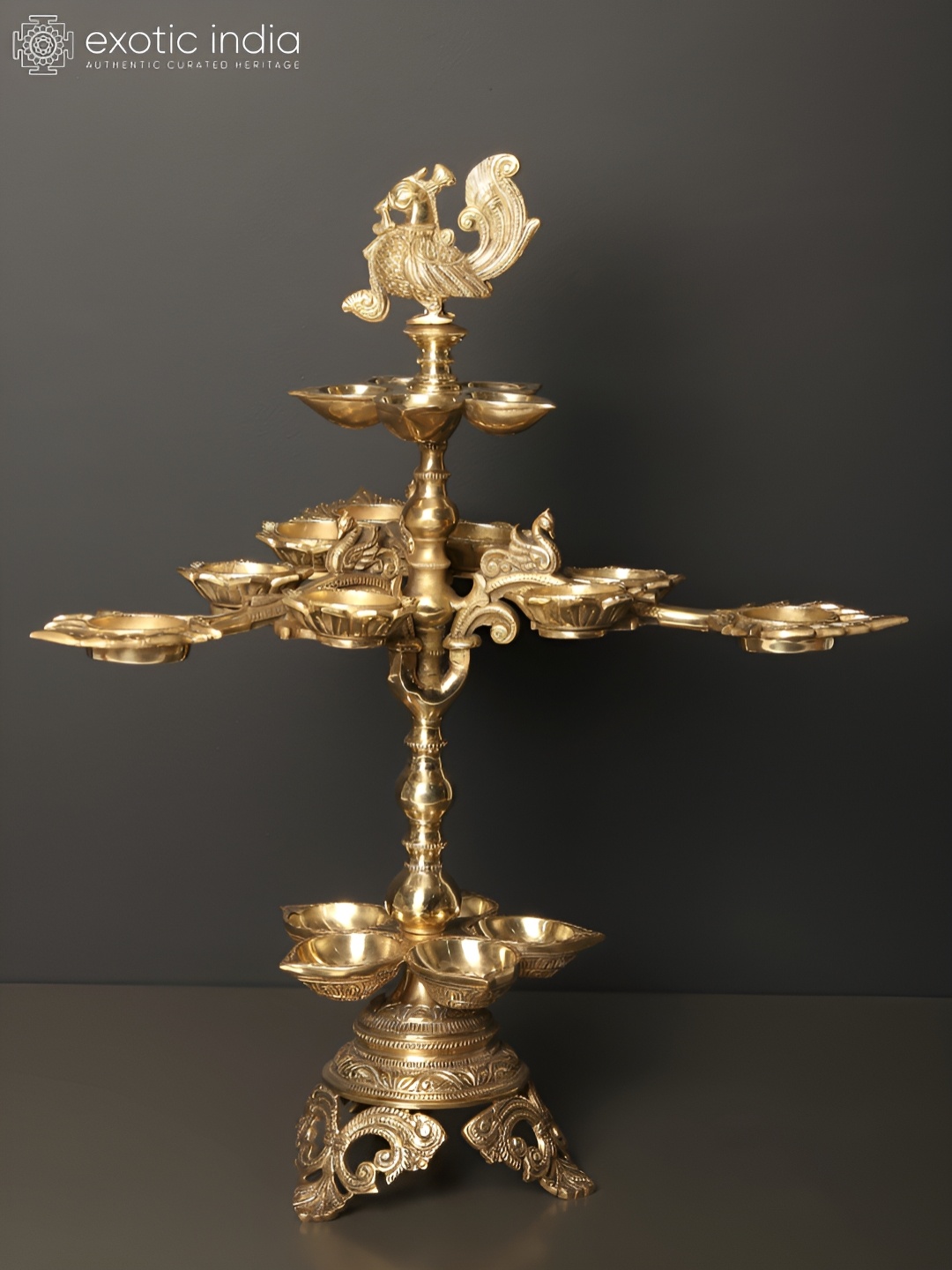 

Exoitc India Brass Nineteen Wicks Designer Peacocks Lamp, Gold