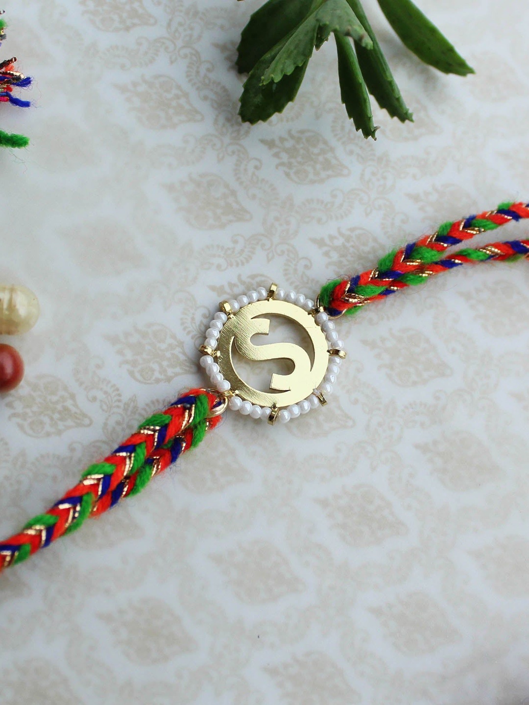 

BeAbhika S Initial Beaded Thread Rakhi With Roli Chawal, Green