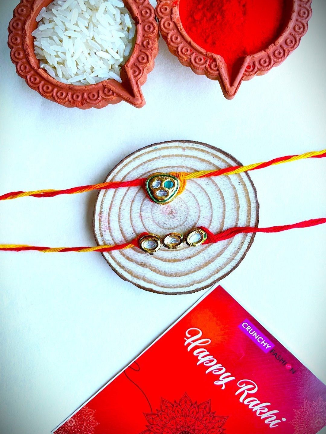 

Crunchy Fashion Set Of 2 Kundan Studded Thread Rakhis With Roli Chawal, Red