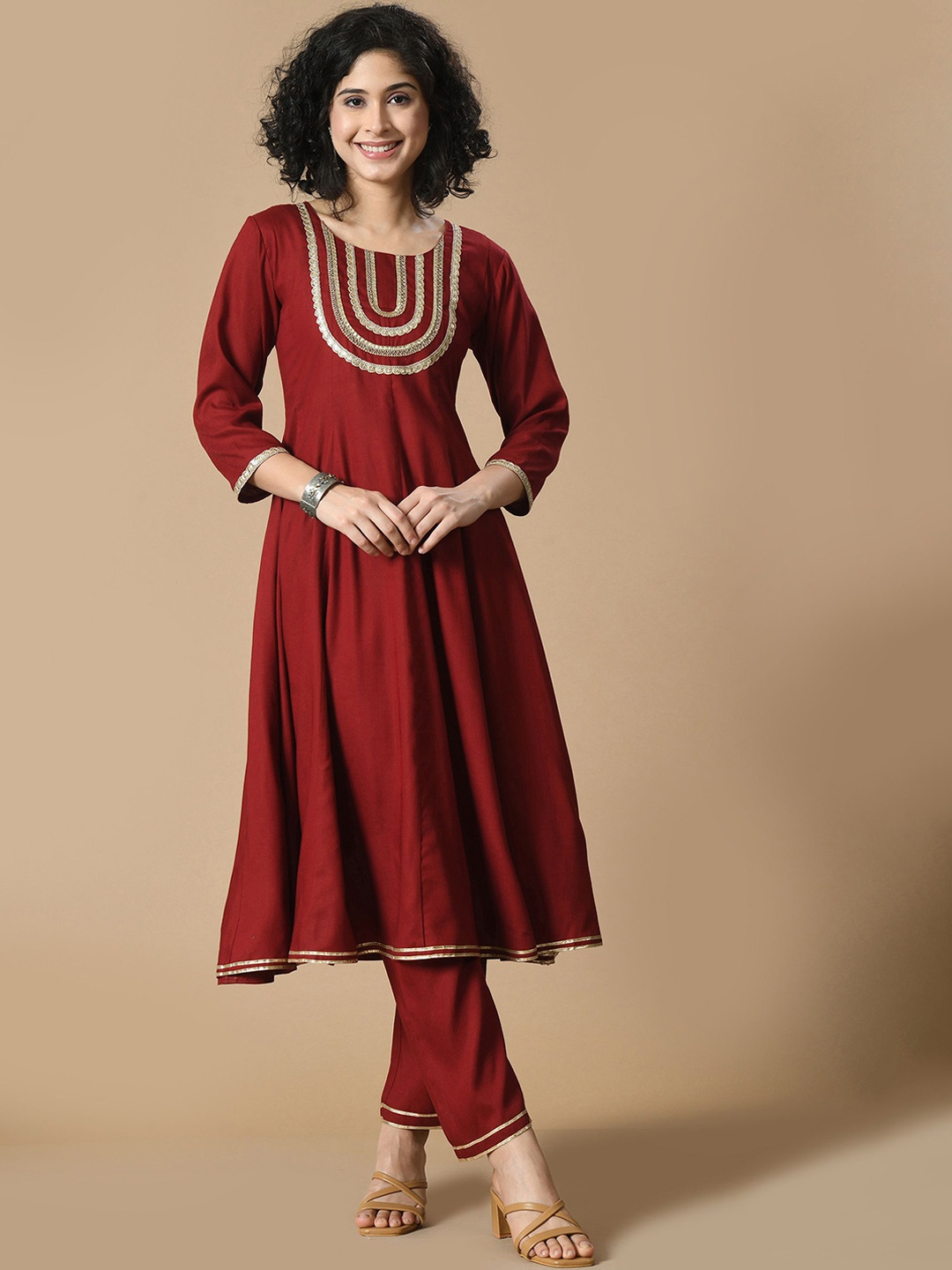 

Sangria Maroon Round Neck Yoke Design Gotta Patti Zari Anarkali Kurta With Trousers