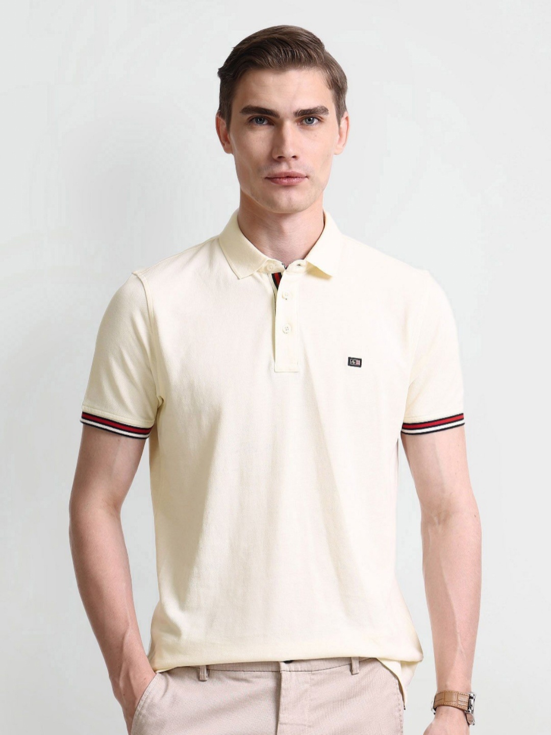 

Arrow Men Solid Polo Collar Cotton T-shirt, Cream