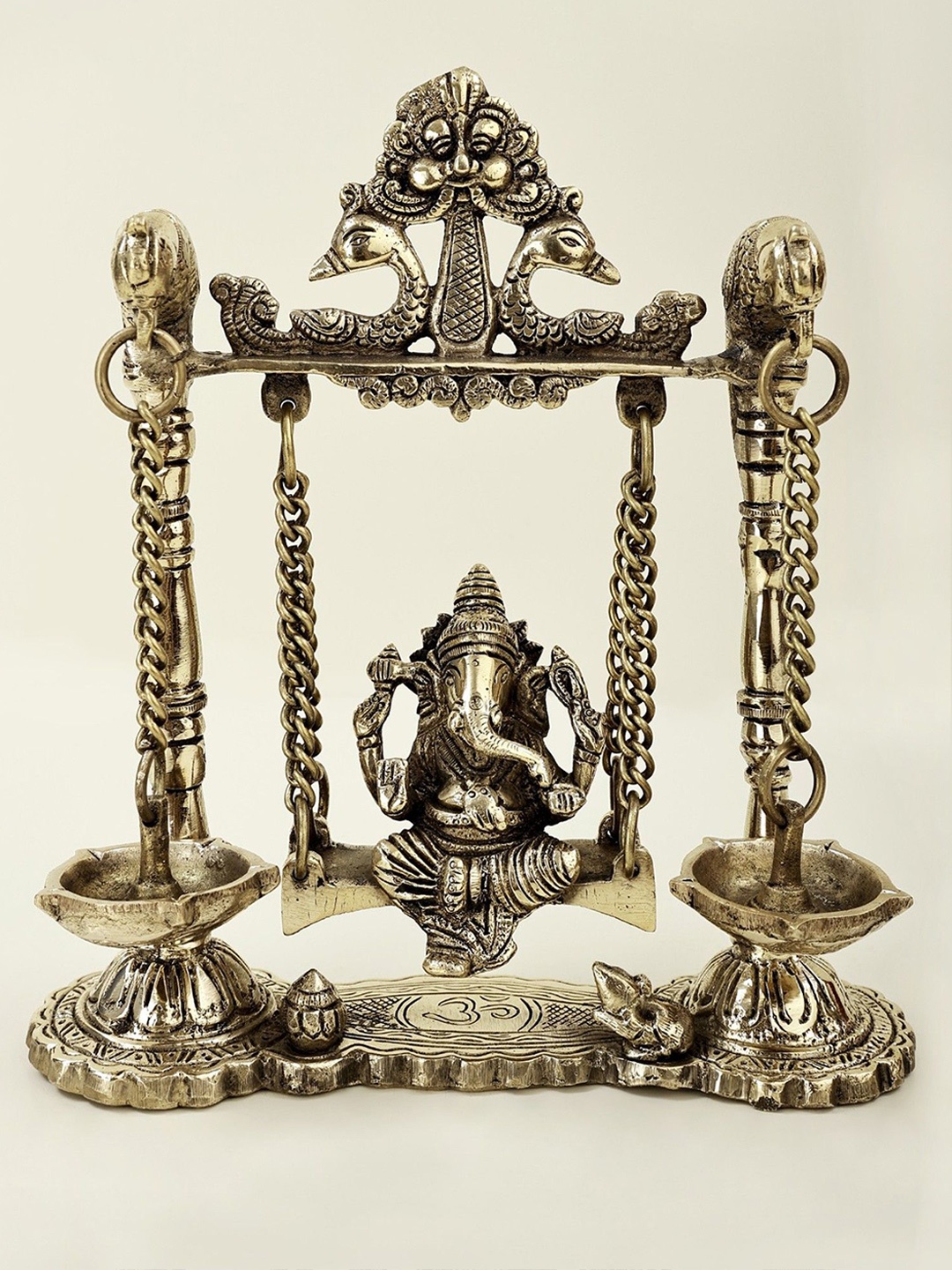 

Exotic India Silver Toned & Brown Textured Lord Ganesha Idol on Parrot Swing