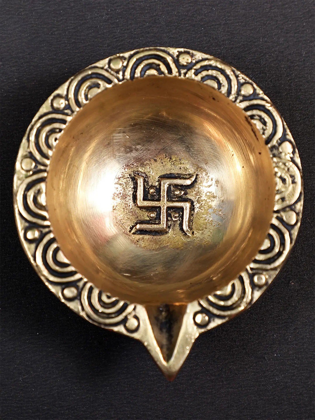 

Exotic India 2" Small Swastik Design Diya in Brass, Gold