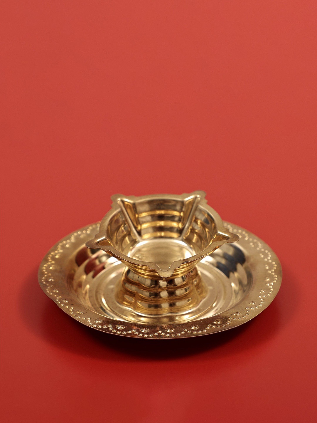 

Exotic India Gold-Toned Brass Panchamukhi Diya On Plate