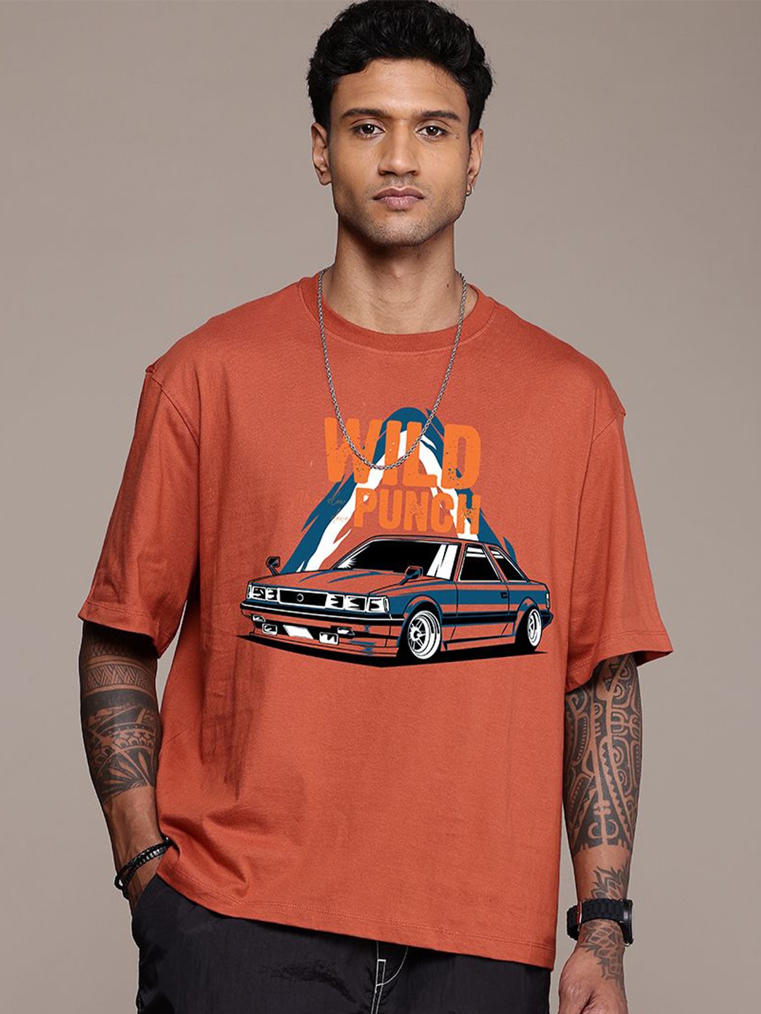 

The Roadster Lifestyle Co. Men Graphic Printed Round Neck Cotton Oversized T-Shirt, Rust