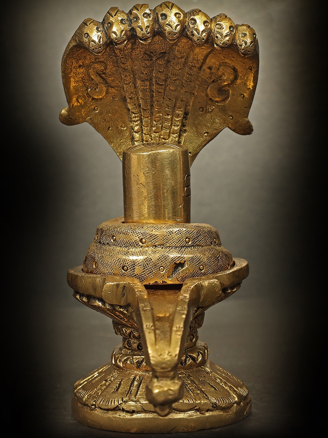 

Exotic India Gold-Toned Shiva Linga with Sheshnaag Religious Idol Showpiece