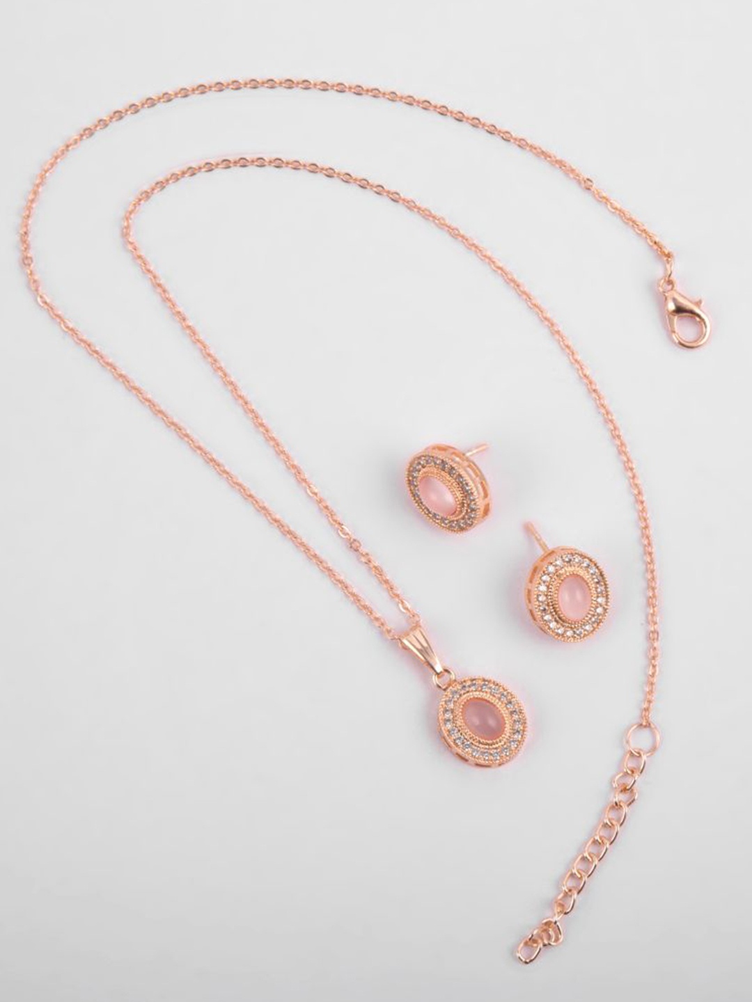 

Kord Store Rose Gold Plated American Diamond Studded Oval Shape Pendant Set