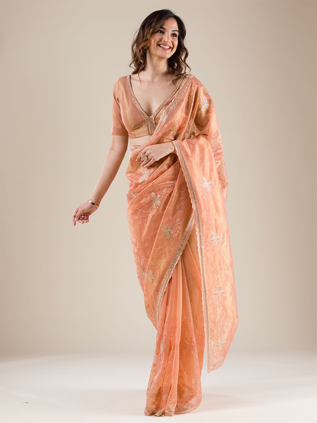 

Koskii Ethnic Motif Embellished Tissue Saree, Peach